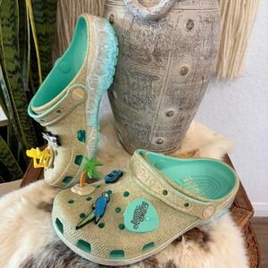 Crocs X Margaritaville Jimmy Buffett Classic Clogs featuring a sand-textured